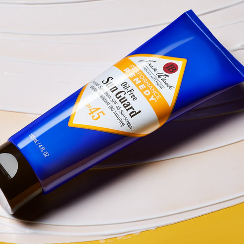 White bottle of Oil-Free Sun Guard SPF 45 sunscreen with pump dispenser.