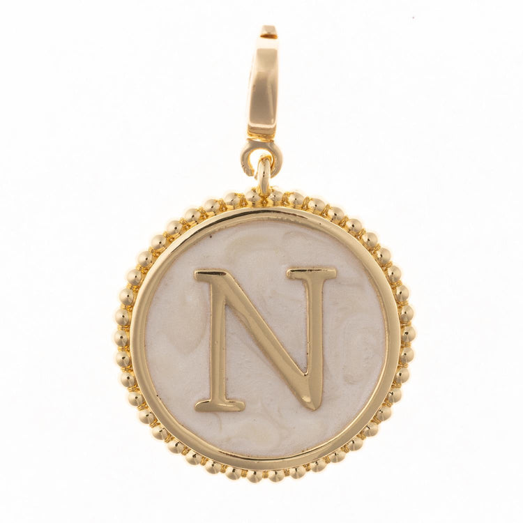 Circular initial charm in 18k gold plating with faux mother-of-pearl inlay and clasp.