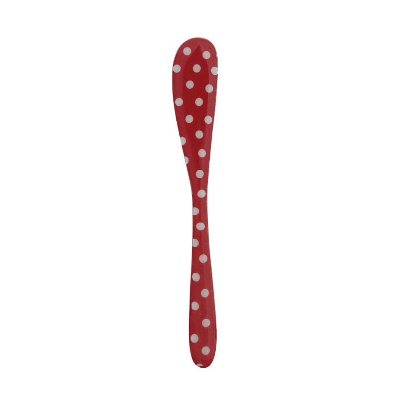 Red enameled stainless steel canape knife with white polka dots.
