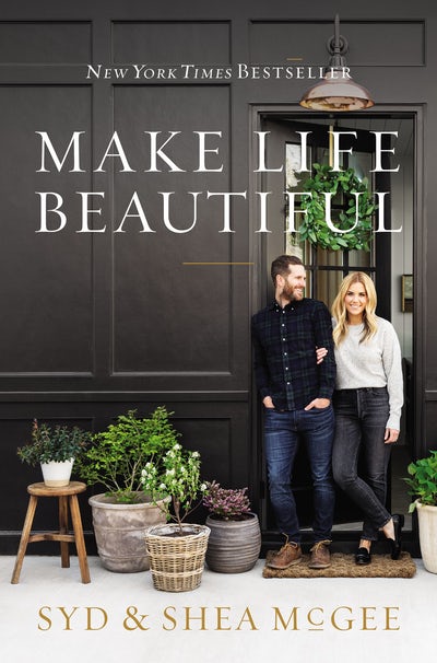 Make Life Beautiful book cover featuring Syd & Shea McGee standing in front of a dark paneled door with plants.