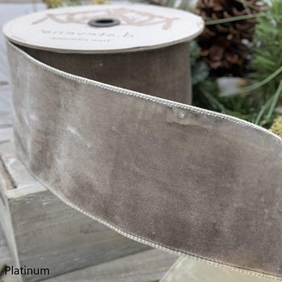 4-inch wide platinum lush velvet ribbon with metallic backing on a spool.