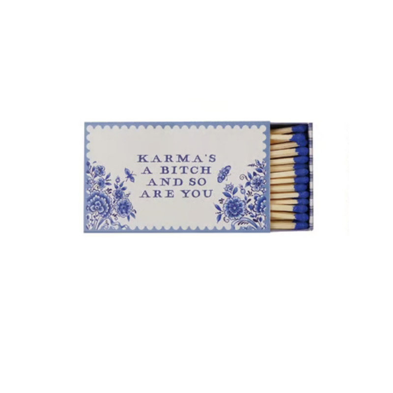 Blue and white floral matchbox with the text "Karma's a bitch and so are you" and blue matches.