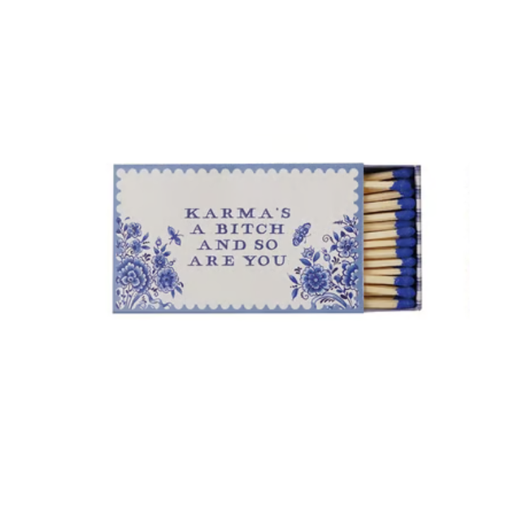 Blue and white floral matchbox with the text "Karma's a bitch and so are you" and blue matches.
