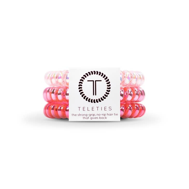 Small pink hair tie with a bracelet-style loop design