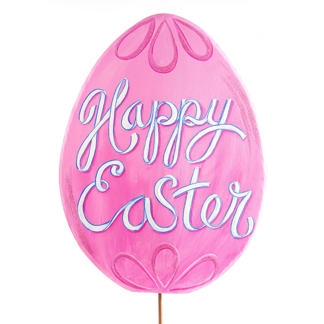 Pink ceramic Easter egg with 'Happy Easter' text in white script on a pastel background.