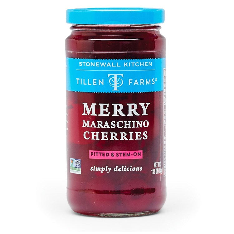 Jar of red maraschino cherries with stems in clear glass