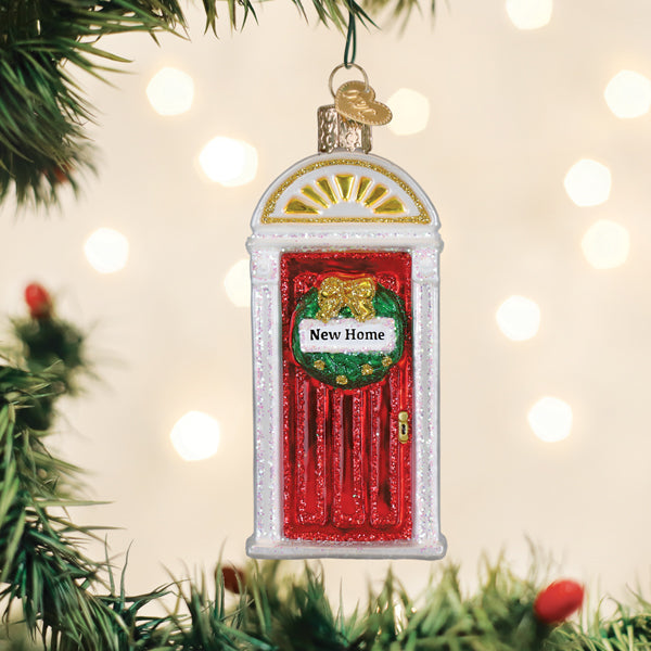 New Home ornament featuring a cozy room interior scene with warm lighting.