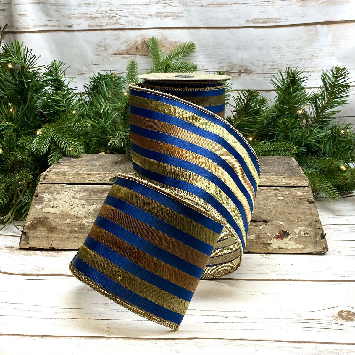 Orange, yellow, and blue irregular striped ribbon with a scalloped edge.