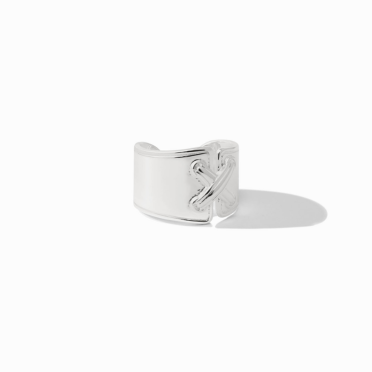 Essex Ring in silver featuring a wide band with a decorative cross-stitch design and open back.