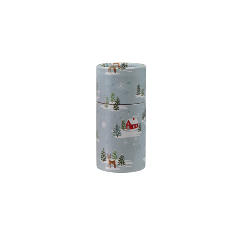 Safety matches in a light blue tube with a winter scene featuring a red house, deer, and trees.
