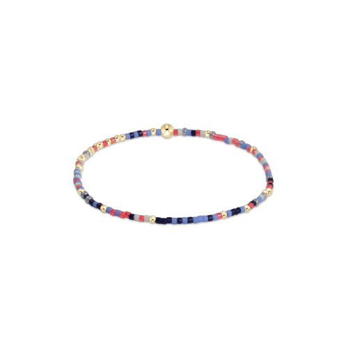 Hope Unwritten bracelet featuring mixed seed beads in various colors with gold-filled accents on stretch elastic.