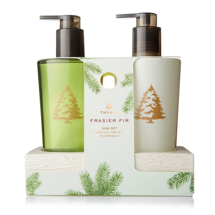 Frasier Fir Sink Set with green soap, white lotion, and a ceramic caddy in festive packaging.