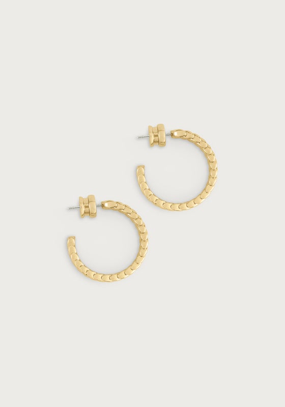 A pair of 18K gold plated brass hoop earrings with a textured braided reins motif.