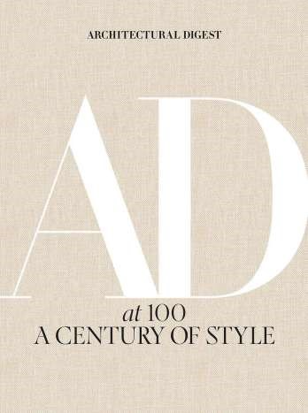 Architectural Digest At 100 hardcover book with a white cover featuring black text and architectural photography.