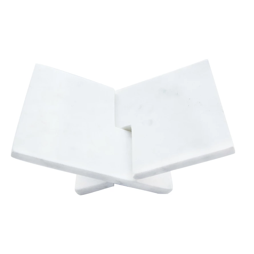 Interlocking marble book holder in white with a geometric cutout pattern.