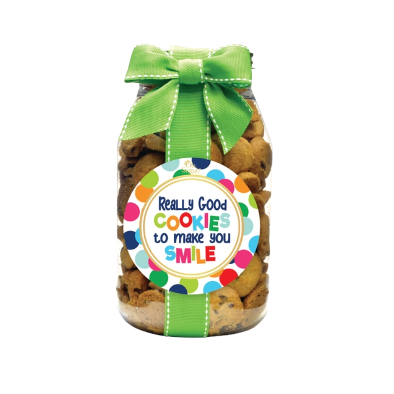 Quart jar of chocolate chip cookies with a green ribbon and a colorful polka dot label.