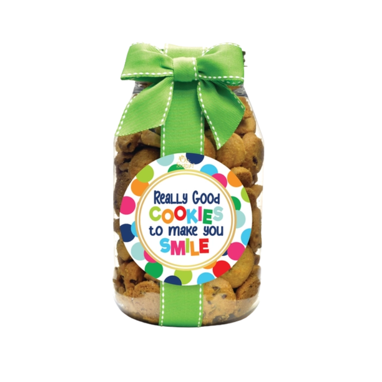 Quart jar of chocolate chip cookies with a green ribbon and a colorful polka dot label.