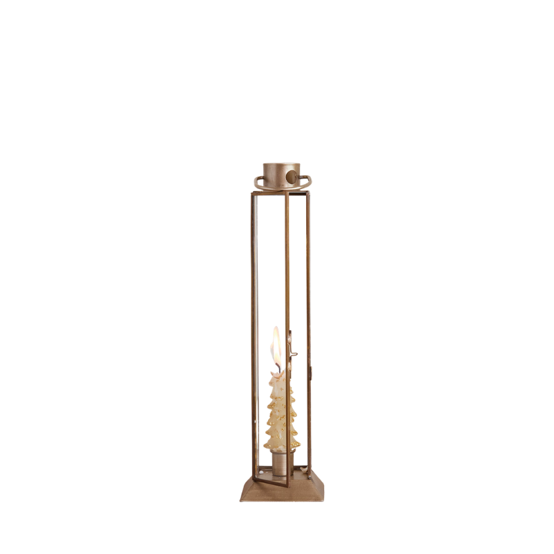 Small gold finish metal and glass lantern taper holder with a lit tree-shaped candle inside.
