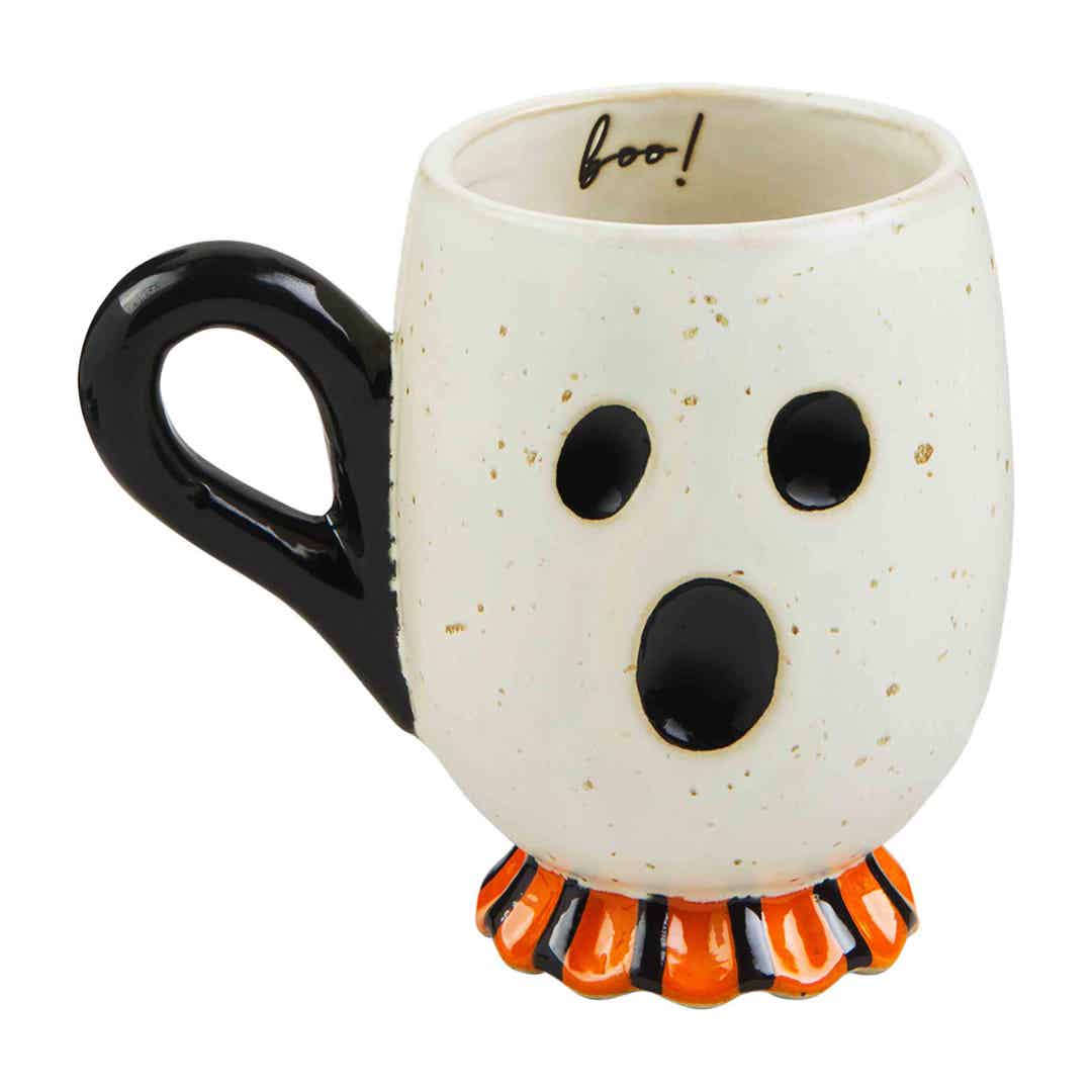 Black stoneware Halloween mug with white ghost illustrations on a dark background.