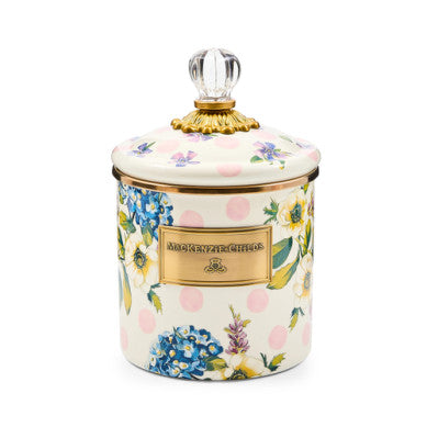 Pink wildflower-patterned steel canister with bronzed stainless rim and brass accents
