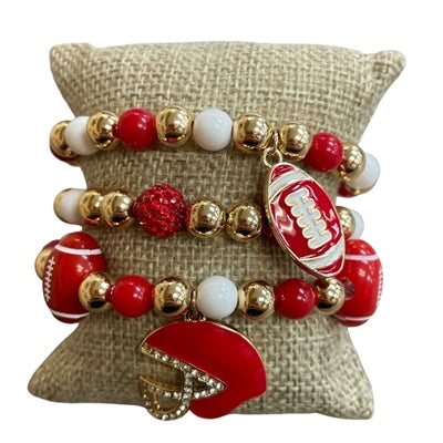 Set of three red, white, and gold beaded stretch bracelets with football and helmet charms.