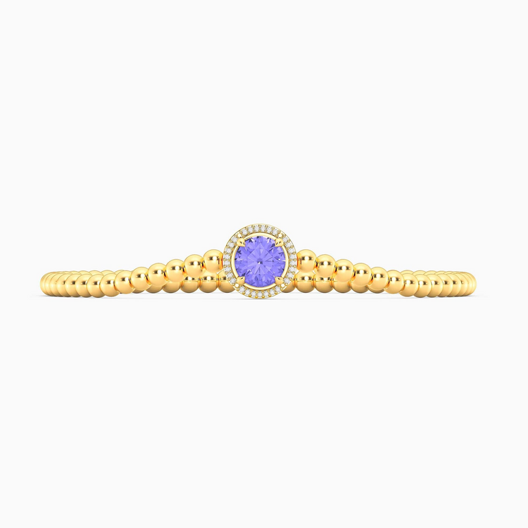 Gold plated beaded bracelet with a round-cut tanzanite center stone and diamond halo.