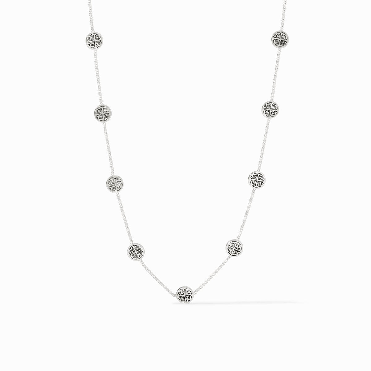 Silver Valencia Delicate Station Necklace with nine circular patterned charms on a fine chain.
