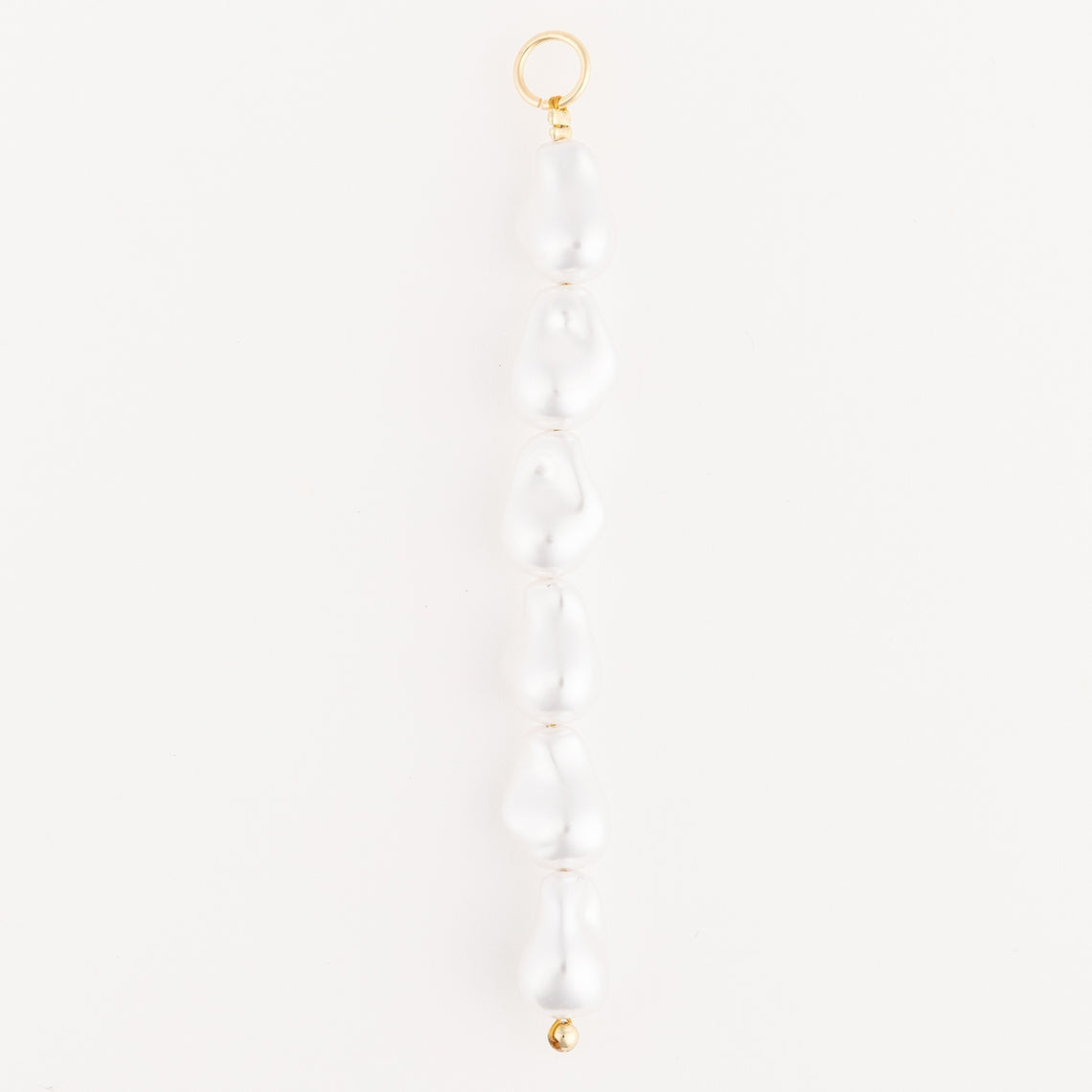 Tropical Bag Charm featuring a vertical row of six white baroque pearls with 18K gold-plated clasp.
