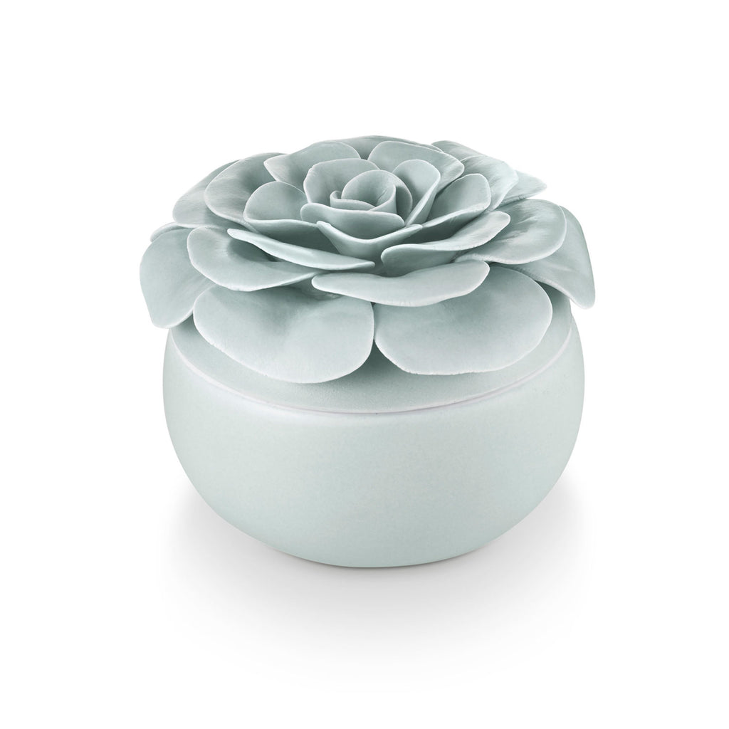 Ceramic flower candle with three wicks in petal-shaped blooms.