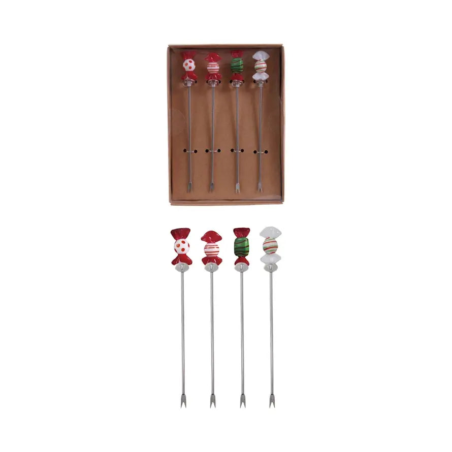 Set of stainless steel appetizer picks topped with colorful blown glass candy accents.