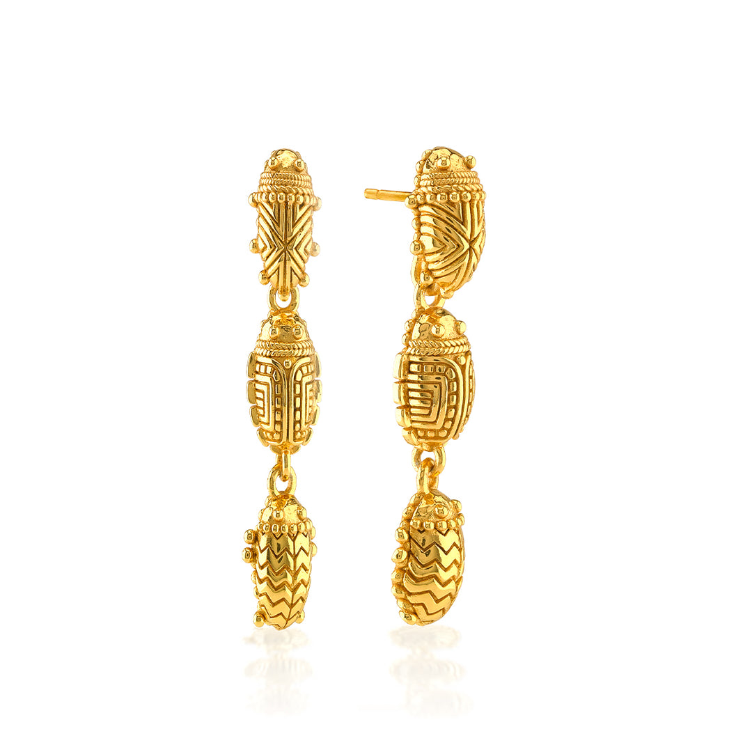 Gold Scarab Petite Linear Earrings featuring three vertically cascading, detailed scarab motifs.