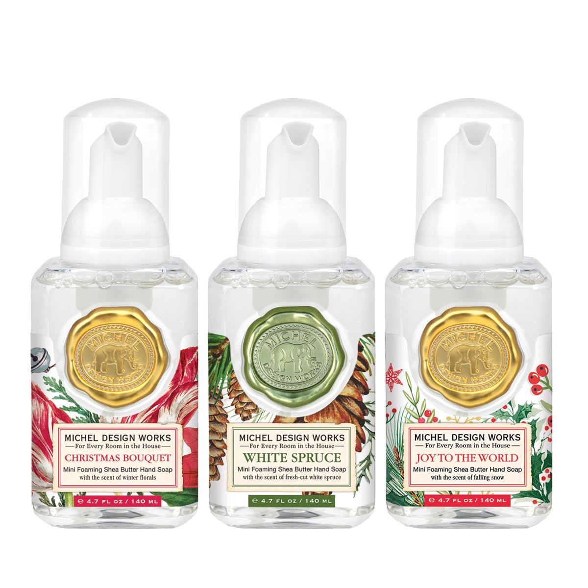 Set of three mini foaming soap dispensers in complementary scents with compact cylindrical silhouettes.