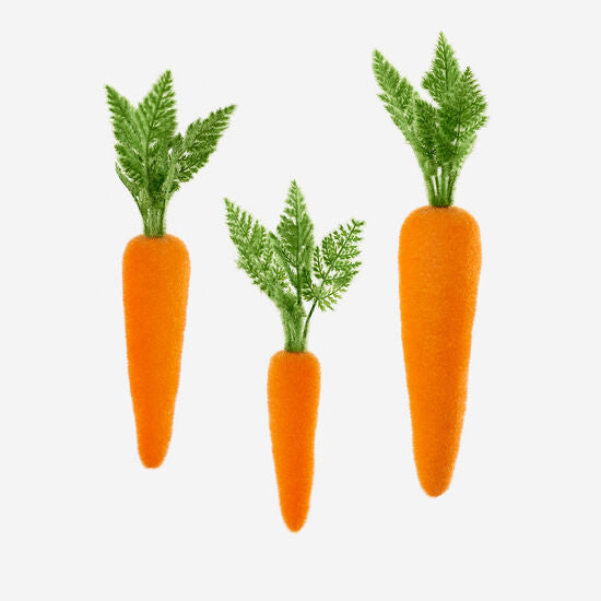Flocked orange carrot-shaped PVC toy sold individually.