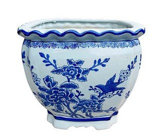 Square ceramic planter in blue with white floral bird design and scalloped rim.
