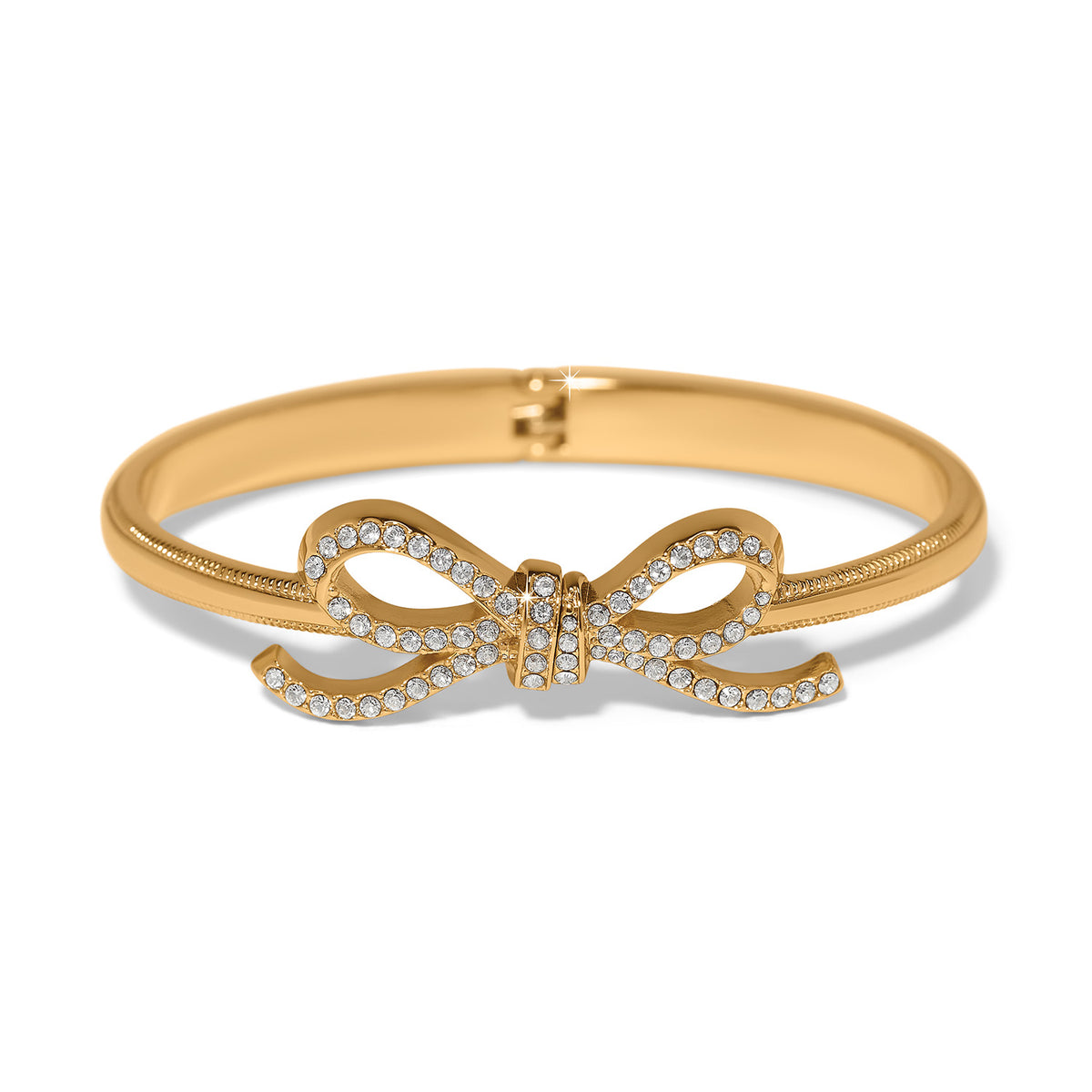 Gold plated hinged bangle with fine quality crystals in a bow silhouette