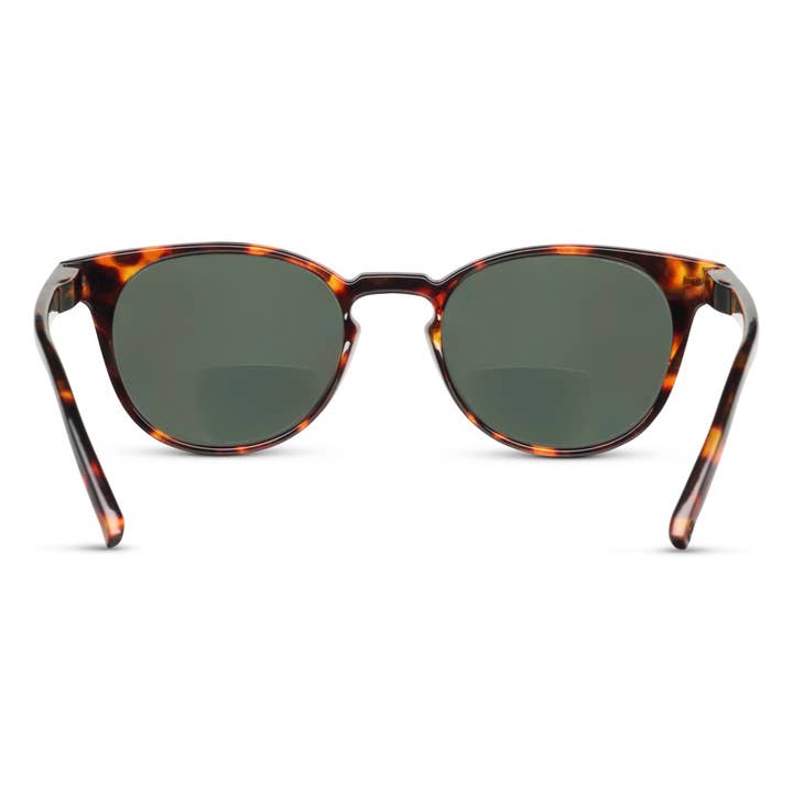 Boho II Bifocal Sun in tortoise with round frames and solid green lenses.