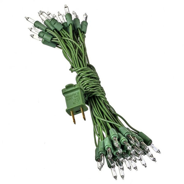 Clear corded Christmas lights with green bulbs in a classic twinkling pattern