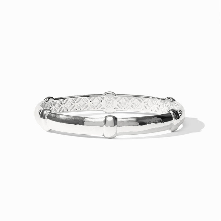 Sahara Bangle in silver with a hammered texture, decorative bands, and an intricate inner pattern.