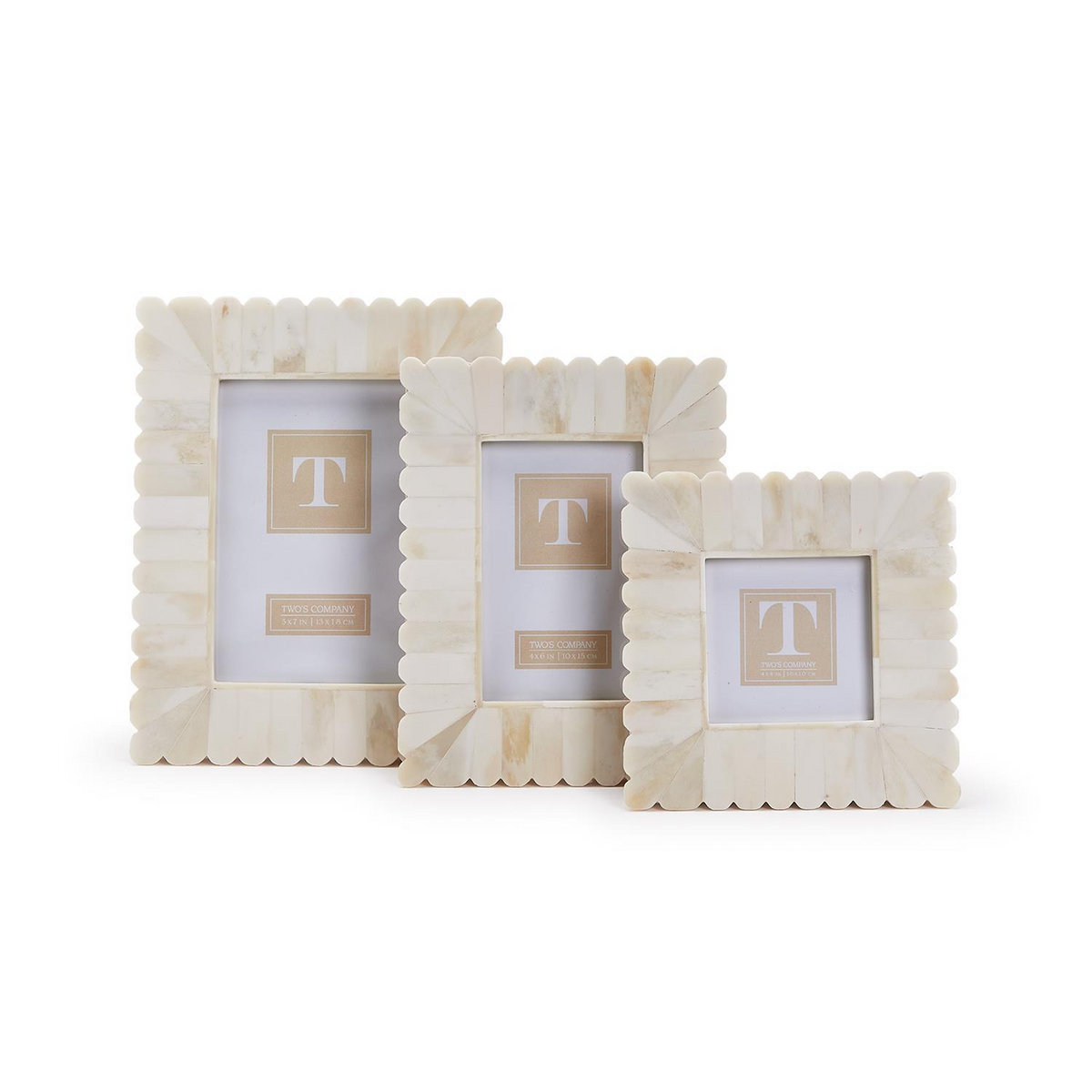 Three scalloped bone photo frames in varying sizes, featuring a cream-colored inlaid design.