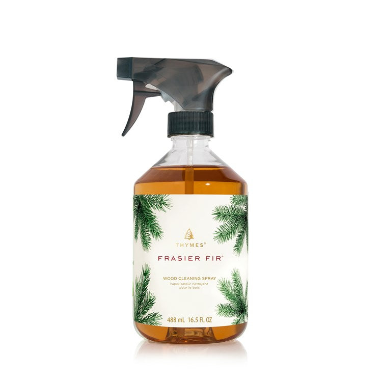 Frasier Fir Wood Cleaning Spray in a clear bottle with a black spray nozzle and pine needle design.
