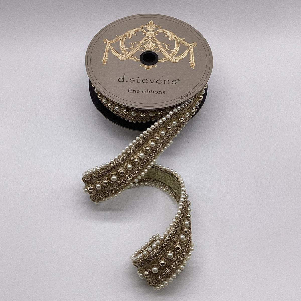 1.75 inch gold metallic jewel pearl Poiret trim on a d.stevens spool.