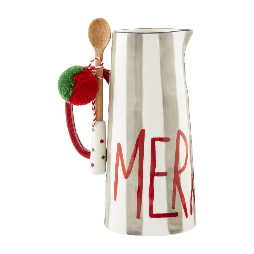 White dolomite pitcher set with matching spoon on a neutral background.