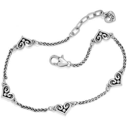 Silver-plated adjustable anklet featuring five petite hearts with crystal centers.