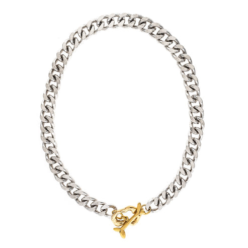 South Necklace featuring a silver-tone curb chain with a sculptural gold-tone toggle clasp.