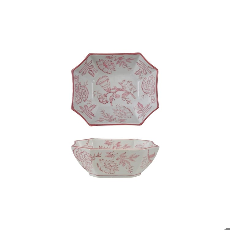 Octagonal pink and white stoneware bowl with a botanical pattern on the interior and exterior.