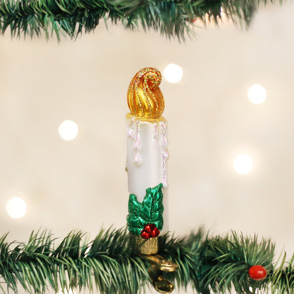 Clip-on candle ornament with a white wax body and gold metallic clip.