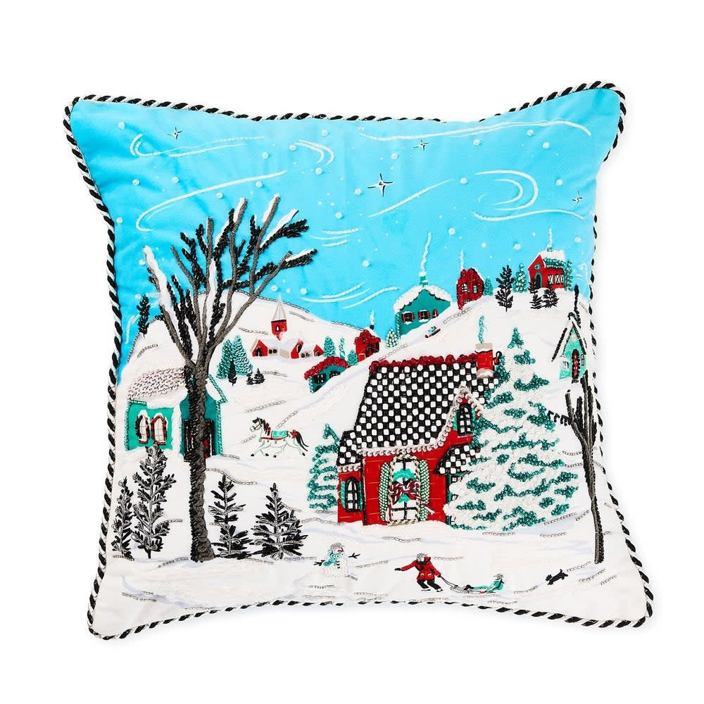 Square cotton throw pillow featuring an embroidered wintry village scene with beading accents.