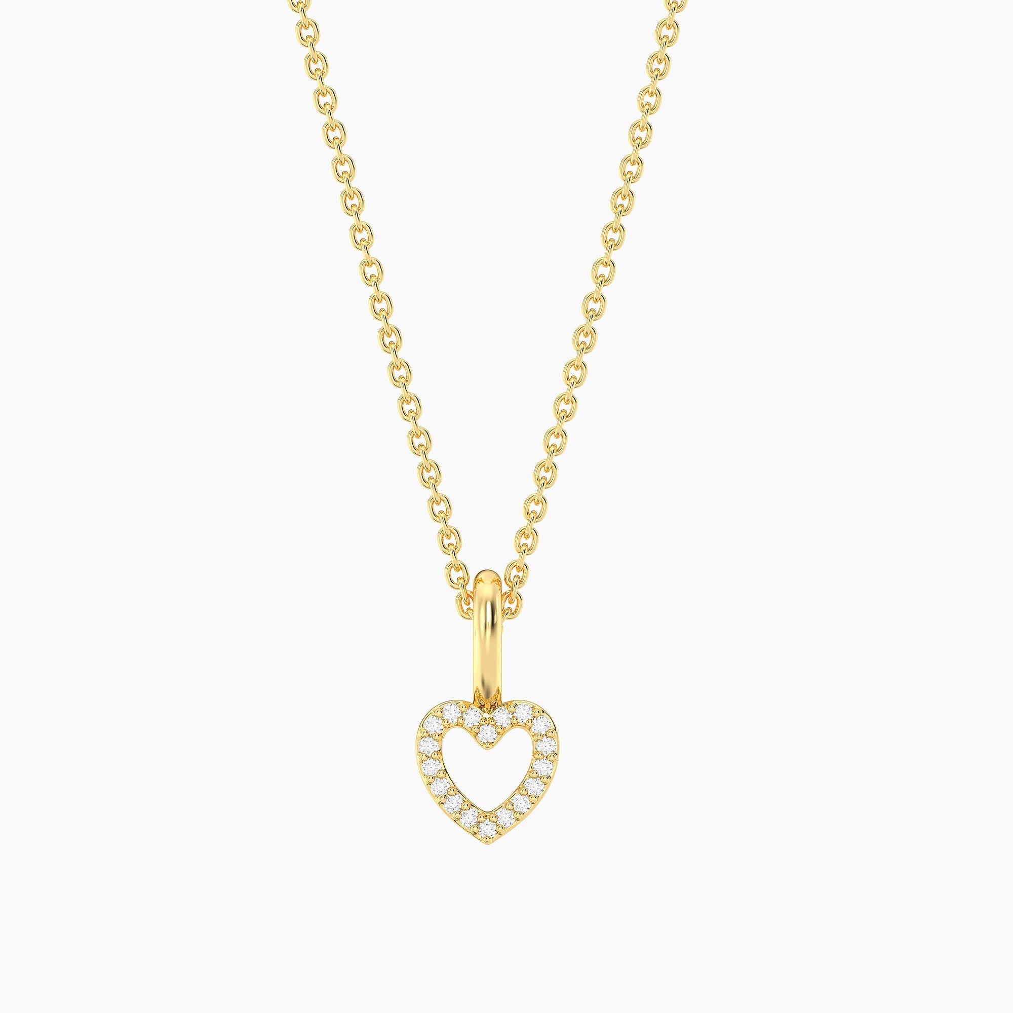 Gold plated waterproof petite heart pendant necklace with diamond accents on a delicate chain.