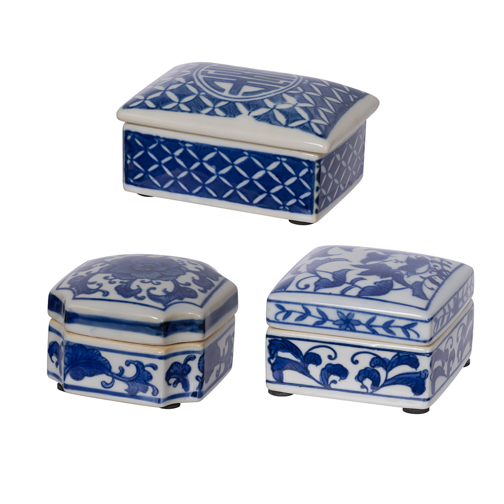 Three porcelain decorative boxes with intricate blue and white patterns designed to store jewelry.