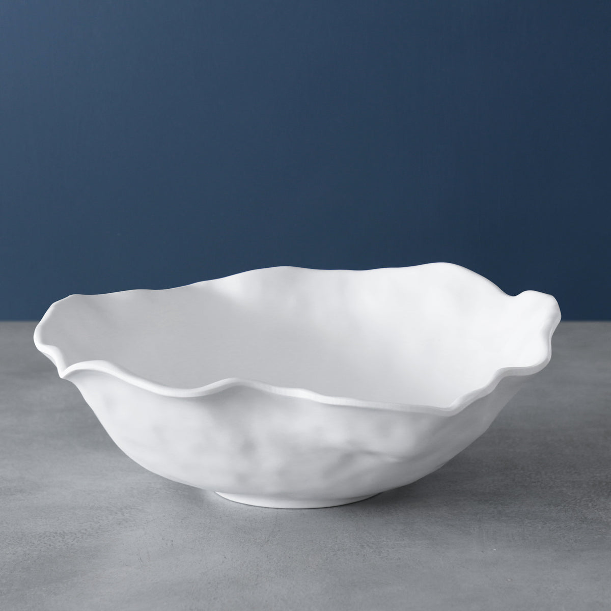 White satin-finish large round melamine bowl with a matte surface.